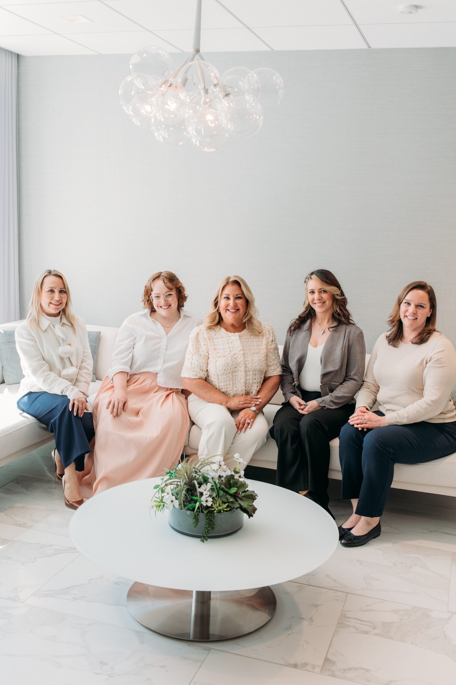 Beth McCormack seated with her legal team
